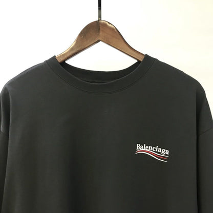 BALENCIAGA MEN’S POLITICAL CAMPAIGN T-SHIRT LARGE FIT IN GREY – BAS019