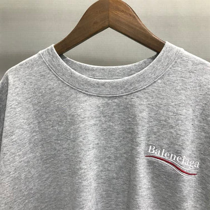 BALENCIAGA MEN’S POLITICAL CAMPAIGN T-SHIRT LARGE FIT IN GREY – BAS021