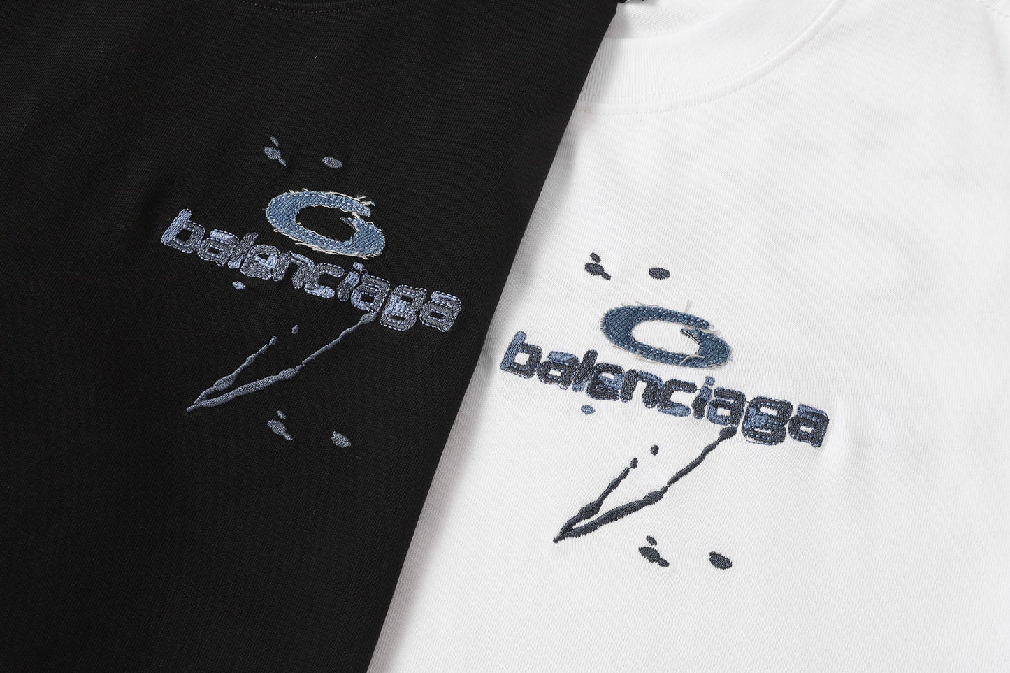 Balenciaga T-shirt featuring intricate, high-density, double-layered 3D embroidery and a washed-denim appliqué.