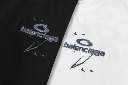 Balenciaga T-shirt featuring intricate, high-density, double-layered 3D embroidery and a washed-denim appliqué.