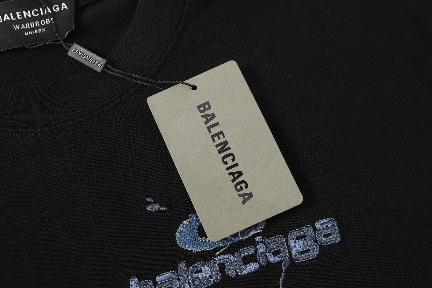 Balenciaga T-shirt featuring intricate, high-density, double-layered 3D embroidery and a washed-denim appliqué.